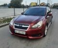 Красный Субару Легаси, объемом двигателя 2.5 л и пробегом 175 тыс. км за 7600 $, фото 1 на Automoto.ua