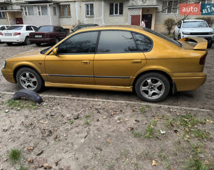 Желтый Субару Легаси, объемом двигателя 2.46 л и пробегом 345 тыс. км за 4100 $, фото 8 на Automoto.ua