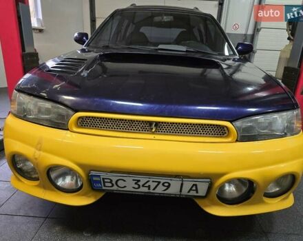 Желтый Субару Легаси, объемом двигателя 2.46 л и пробегом 137 тыс. км за 3300 $, фото 1 на Automoto.ua