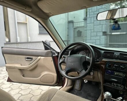 Красный Субару Аутбек, объемом двигателя 2.5 л и пробегом 2 тыс. км за 4300 $, фото 6 на Automoto.ua