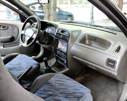 Черный Сузуки Балеро, объемом двигателя 1.3 л и пробегом 332 тыс. км за 2800 $, фото 2 на Automoto.ua