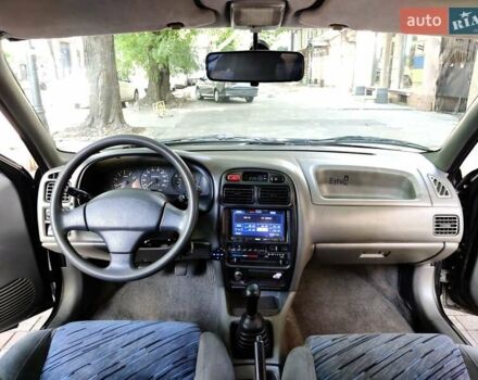 Черный Сузуки Балеро, объемом двигателя 1.3 л и пробегом 332 тыс. км за 2800 $, фото 1 на Automoto.ua