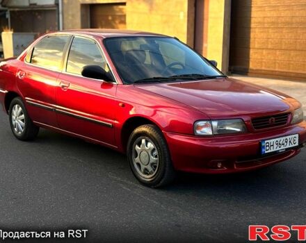 Красный Сузуки Балеро, объемом двигателя 1.6 л и пробегом 200 тыс. км за 2100 $, фото 1 на Automoto.ua