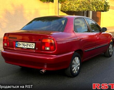 Красный Сузуки Балеро, объемом двигателя 1.6 л и пробегом 200 тыс. км за 2100 $, фото 4 на Automoto.ua