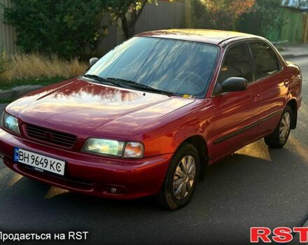 Красный Сузуки Балеро, объемом двигателя 1.6 л и пробегом 200 тыс. км за 2100 $, фото 1 на Automoto.ua