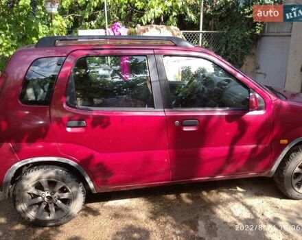 Красный Сузуки Игнис, объемом двигателя 1.33 л и пробегом 320 тыс. км за 1900 $, фото 2 на Automoto.ua