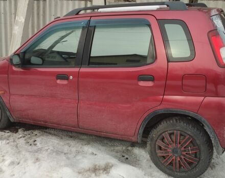 Красный Сузуки Игнис, объемом двигателя 1.3 л и пробегом 250 тыс. км за 600 $, фото 1 на Automoto.ua