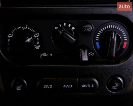 Білий Сузукі Джімні, об'ємом двигуна 1.3 л та пробігом 122 тис. км за 14900 $, фото 22 на Automoto.ua