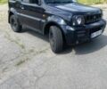 Черный Сузуки Джимни, объемом двигателя 1.3 л и пробегом 76 тыс. км за 8189 $, фото 1 на Automoto.ua