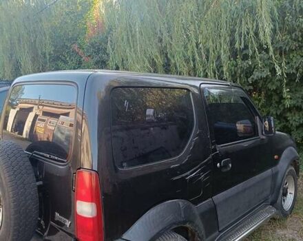 Черный Сузуки Джимни, объемом двигателя 1.3 л и пробегом 234 тыс. км за 4000 $, фото 4 на Automoto.ua