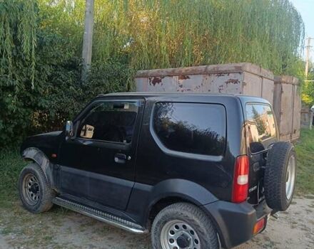 Черный Сузуки Джимни, объемом двигателя 1.3 л и пробегом 234 тыс. км за 4000 $, фото 3 на Automoto.ua
