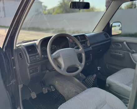Черный Сузуки Джимни, объемом двигателя 1.3 л и пробегом 100 тыс. км за 7200 $, фото 12 на Automoto.ua