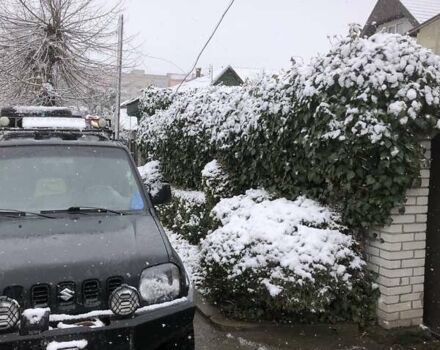 Чорний Сузукі Джімні, об'ємом двигуна 1.3 л та пробігом 164 тис. км за 9900 $, фото 1 на Automoto.ua