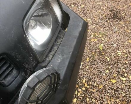 Чорний Сузукі Джімні, об'ємом двигуна 1.3 л та пробігом 164 тис. км за 9900 $, фото 11 на Automoto.ua