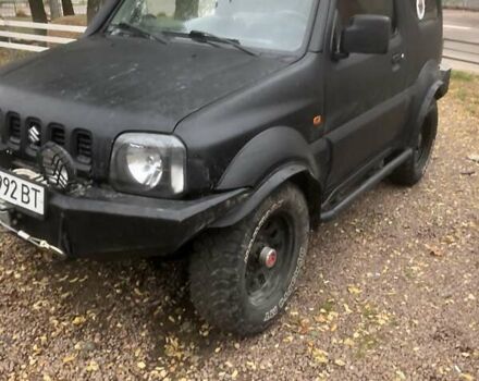 Чорний Сузукі Джімні, об'ємом двигуна 1.3 л та пробігом 164 тис. км за 9900 $, фото 13 на Automoto.ua