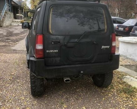 Чорний Сузукі Джімні, об'ємом двигуна 1.3 л та пробігом 164 тис. км за 9900 $, фото 5 на Automoto.ua