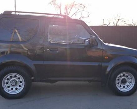 Черный Сузуки Джимни, объемом двигателя 1.3 л и пробегом 225 тыс. км за 6500 $, фото 5 на Automoto.ua