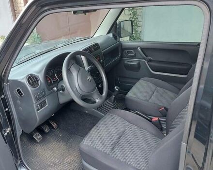 Черный Сузуки Джимни, объемом двигателя 1.3 л и пробегом 60 тыс. км за 13000 $, фото 14 на Automoto.ua