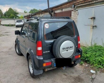 Черный Сузуки Джимни, объемом двигателя 1.3 л и пробегом 60 тыс. км за 13000 $, фото 2 на Automoto.ua
