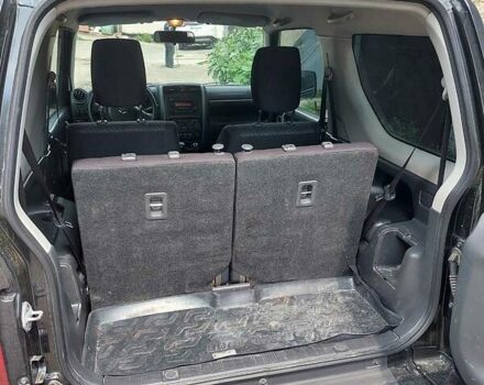 Черный Сузуки Джимни, объемом двигателя 1.3 л и пробегом 60 тыс. км за 13000 $, фото 7 на Automoto.ua