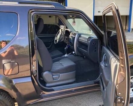 Коричневый Сузуки Джимни, объемом двигателя 1.3 л и пробегом 110 тыс. км за 16000 $, фото 2 на Automoto.ua