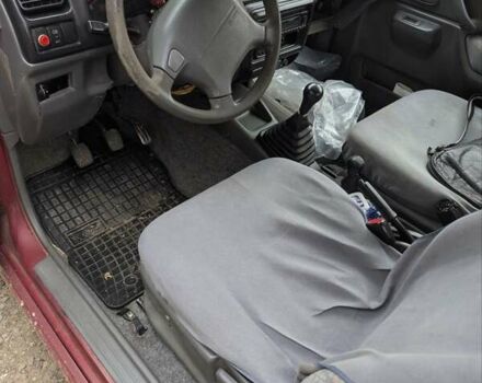 Красный Сузуки Джимни, объемом двигателя 1.3 л и пробегом 185 тыс. км за 5999 $, фото 5 на Automoto.ua