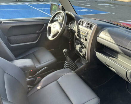 Сузуки Джимни 2006 в Киеве на Automoto.ua Красный Сузуки Джимни, объемом двигателя 1.5 л и пробегом 221 тыс. км за 12000 $, фото 10 на Automoto.ua