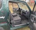 Зелений Сузукі Джімні, об'ємом двигуна 1.3 л та пробігом 170 тис. км за 8700 $, фото 13 на Automoto.ua