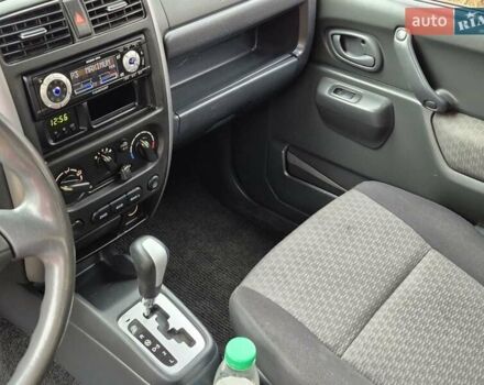 Зелений Сузукі Джімні, об'ємом двигуна 1.3 л та пробігом 170 тис. км за 8700 $, фото 15 на Automoto.ua