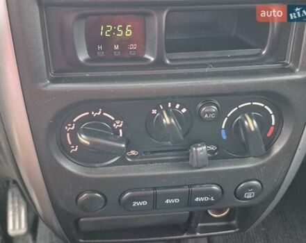 Зелений Сузукі Джімні, об'ємом двигуна 1.3 л та пробігом 170 тис. км за 8700 $, фото 16 на Automoto.ua