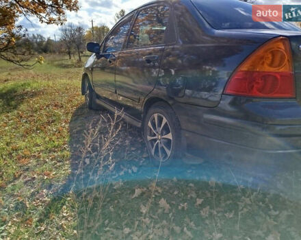 Черный Сузуки Лиана, объемом двигателя 1.6 л и пробегом 300 тыс. км за 3900 $, фото 3 на Automoto.ua