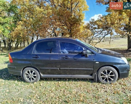 Черный Сузуки Лиана, объемом двигателя 1.6 л и пробегом 300 тыс. км за 3900 $, фото 1 на Automoto.ua