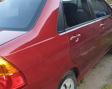 Червоний Сузукі Ліана, об'ємом двигуна 1.6 л та пробігом 290 тис. км за 3500 $, фото 26 на Automoto.ua