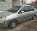 Серый Сузуки Лиана, объемом двигателя 1.3 л и пробегом 320 тыс. км за 2550 $, фото 1 на Automoto.ua