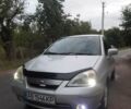Серый Сузуки Лиана, объемом двигателя 1.6 л и пробегом 140 тыс. км за 4500 $, фото 2 на Automoto.ua