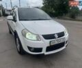 Белый Сузуки СХ4, объемом двигателя 1.6 л и пробегом 287 тыс. км за 5500 $, фото 2 на Automoto.ua