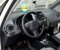 Белый Сузуки СХ4, объемом двигателя 1.6 л и пробегом 174 тыс. км за 7500 $, фото 7 на Automoto.ua