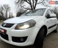 Белый Сузуки СХ4, объемом двигателя 1.6 л и пробегом 192 тыс. км за 5490 $, фото 1 на Automoto.ua