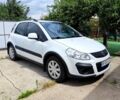 Белый Сузуки СХ4, объемом двигателя 1.6 л и пробегом 97 тыс. км за 9500 $, фото 1 на Automoto.ua