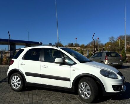 Белый Сузуки СХ4, объемом двигателя 1.6 л и пробегом 125 тыс. км за 9500 $, фото 1 на Automoto.ua