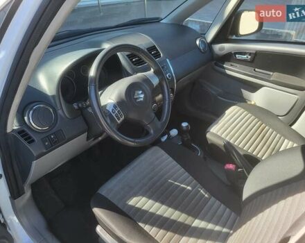 Белый Сузуки СХ4, объемом двигателя 1.6 л и пробегом 130 тыс. км за 9000 $, фото 5 на Automoto.ua