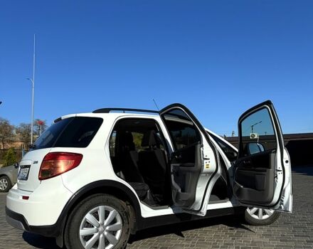 Белый Сузуки СХ4, объемом двигателя 1.6 л и пробегом 125 тыс. км за 9500 $, фото 8 на Automoto.ua