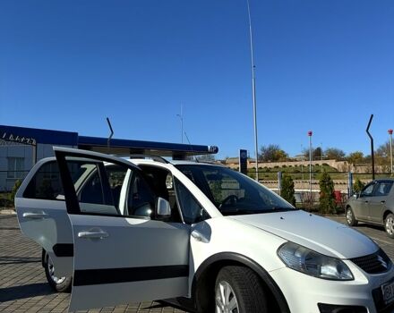 Белый Сузуки СХ4, объемом двигателя 1.6 л и пробегом 125 тыс. км за 9500 $, фото 7 на Automoto.ua
