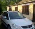 Белый Сузуки СХ4, объемом двигателя 1.6 л и пробегом 70 тыс. км за 9000 $, фото 2 на Automoto.ua