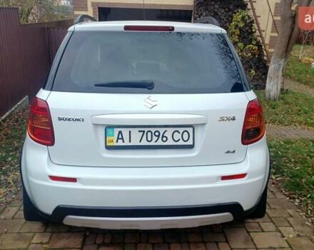Белый Сузуки СХ4, объемом двигателя 1.6 л и пробегом 98 тыс. км за 11000 $, фото 1 на Automoto.ua
