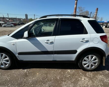 Белый Сузуки СХ4, объемом двигателя 1.6 л и пробегом 124 тыс. км за 8600 $, фото 2 на Automoto.ua