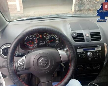 Белый Сузуки СХ4, объемом двигателя 1.6 л и пробегом 98 тыс. км за 11000 $, фото 4 на Automoto.ua