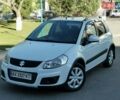 Белый Сузуки СХ4, объемом двигателя 1.6 л и пробегом 125 тыс. км за 9900 $, фото 1 на Automoto.ua