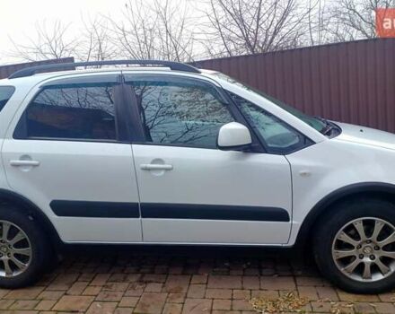 Белый Сузуки СХ4, объемом двигателя 1.6 л и пробегом 98 тыс. км за 11000 $, фото 2 на Automoto.ua
