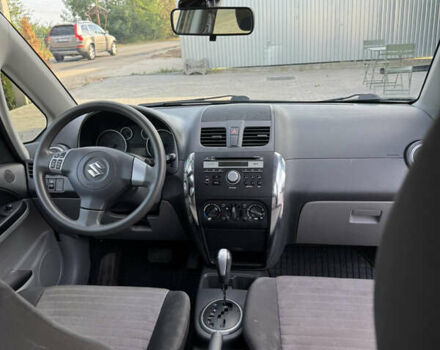 Белый Сузуки СХ4, объемом двигателя 1.59 л и пробегом 134 тыс. км за 9800 $, фото 7 на Automoto.ua